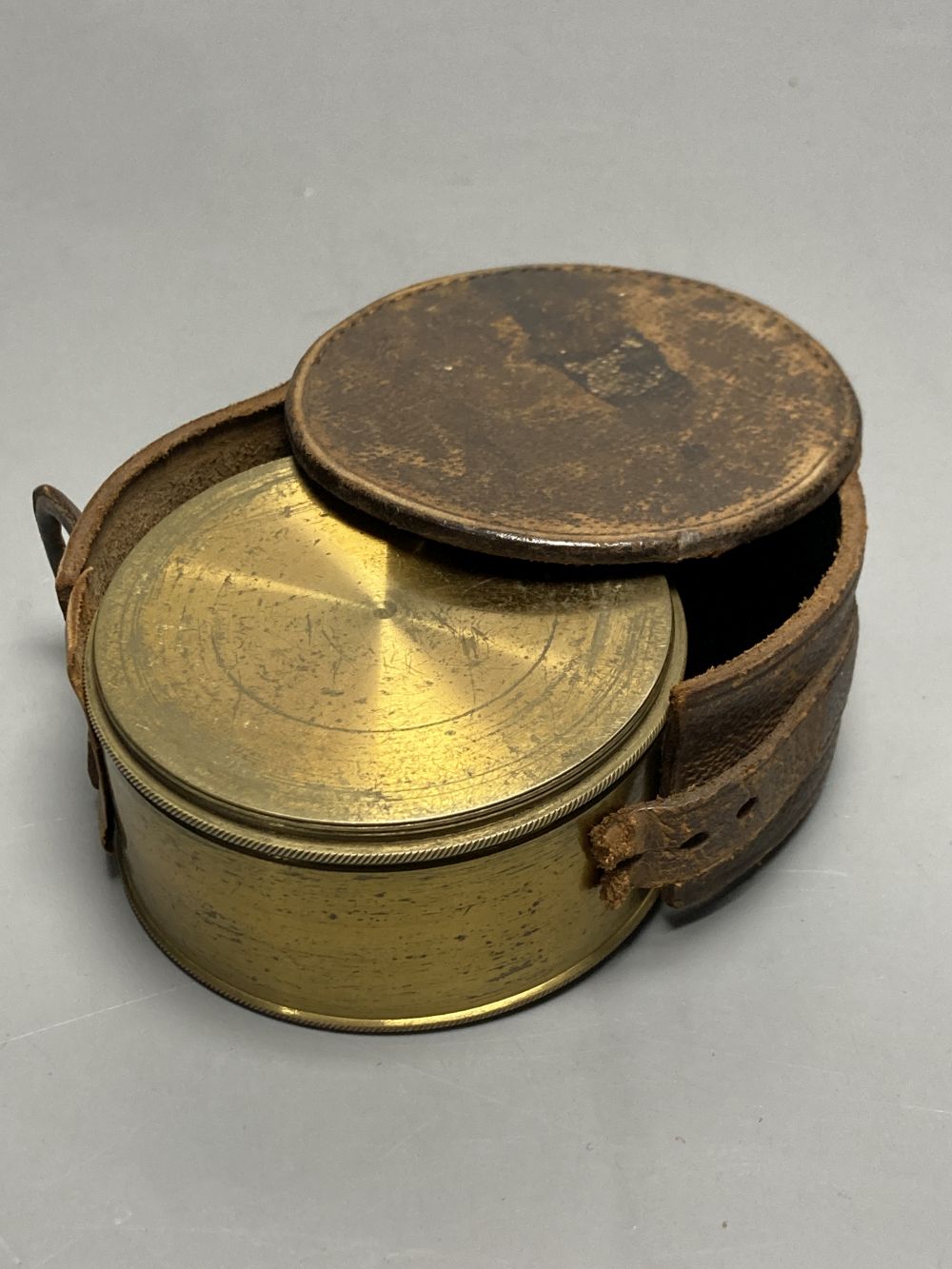 A Victorian brass pocket sextant by Watkins, Charring Cross, London, leather cased